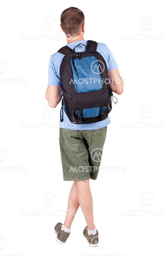 Back view of man with backpack looking up.