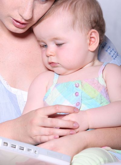 Woman cuddling her baby