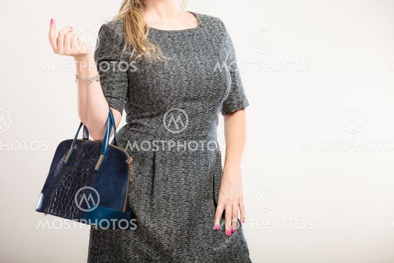 Chic woman with handbag.