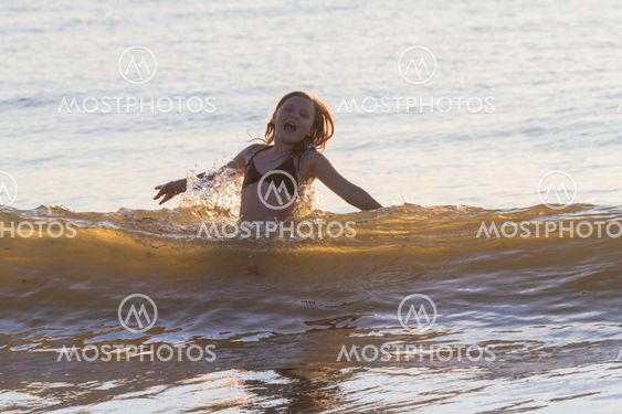 Young girl, 10-15 years old ,swimming
