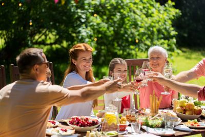 happy family having dinner or summer garden party