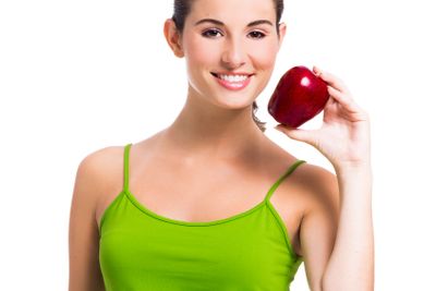 Healthy woman holding an apple