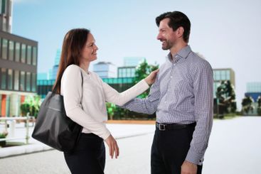 Woman smiles meeting an old friend while traveling