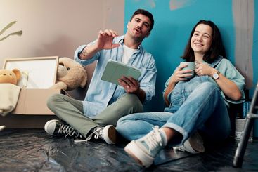 Home, renovation and couple with tablet, baby room and...