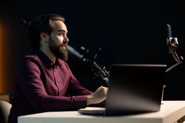 Man using professional microphone to create ambient sounds