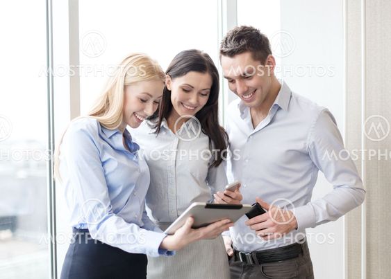 business team working with tablet pcs in office