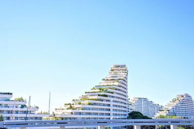 Daylight sunny view from side to ship shaped apartments