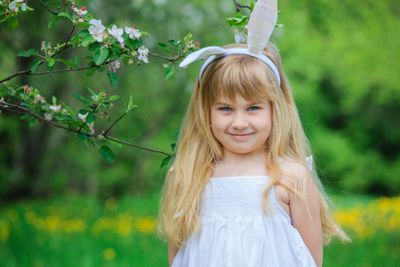 Little girl wearing bunny ears