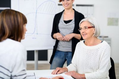 Businesswomen Having a Meeting at the Table