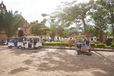 Colourful motorcycle cabs awaiting for tourists in...
