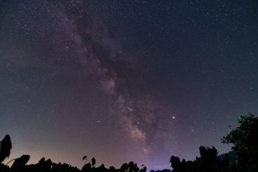 Galactic core of the Milky way galaxy with silhouetted...