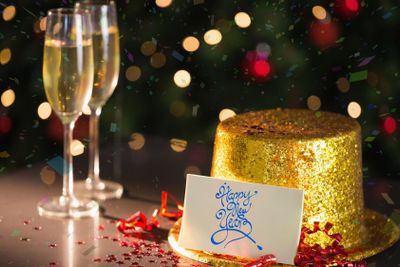 Happy new year card on table set for party