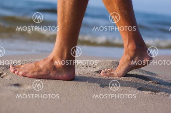 Bare feet at the sea