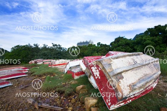 Old fish-boat on sandy beach.