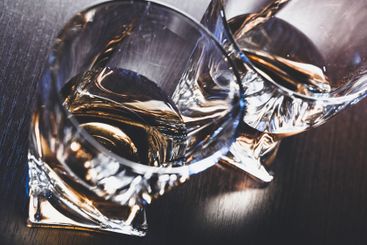 Strong alcoholic drink in glass close up