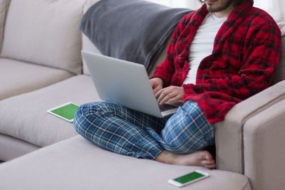 man freelancer in bathrobe working from home