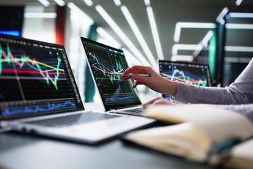 Young businesswoman analyzing stock market data