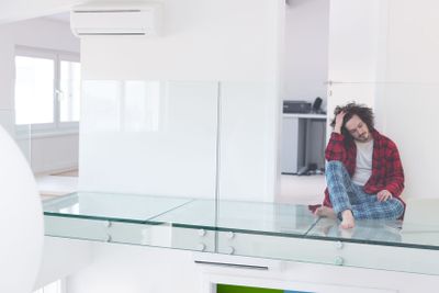 young freelancer in bathrobe working from home