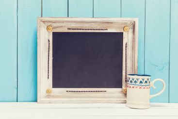 Cozy pastel wooden home decor objects on blue background