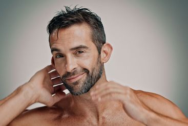 Smile, hair and skincare with portrait of man in studio...