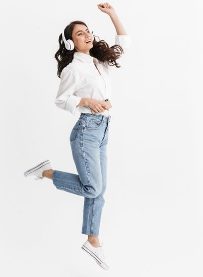 Full length of a cheerful young brunette woman