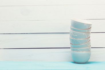 Cozy pastel wooden home decor objects on blue background