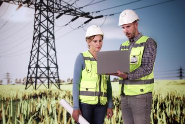 Engineers Using Computer Technology New Energy Tower