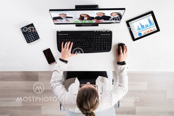 Businesswoman Videoconferencing With Senior Colleague