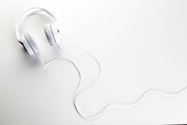 White headphones on white background close up