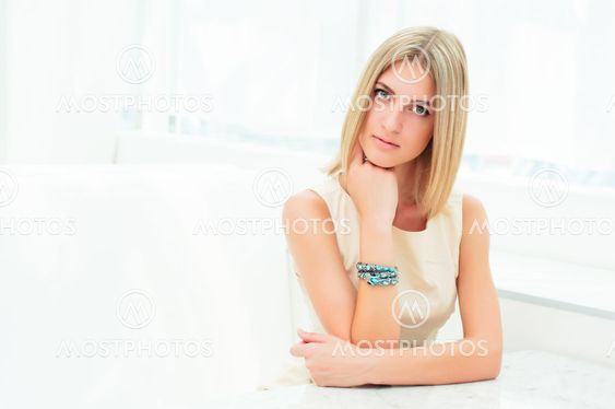 Portrait of a cute woman in a city cafe