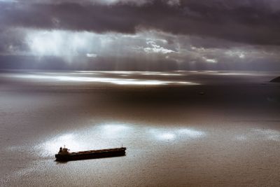 Dark moody sky and Mediterranean Sea with ship leaving...