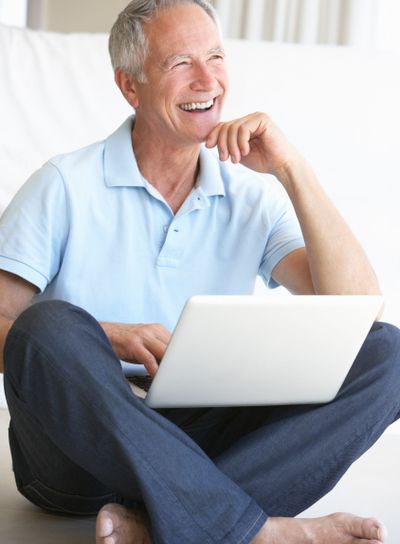 Senior man using laptop computer