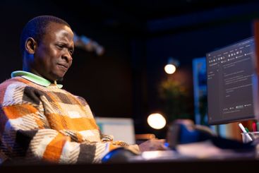 African american self employed developer in home office...