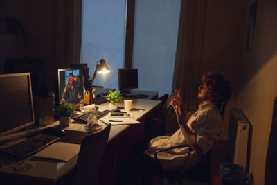Man working in office alone during coronavirus or...