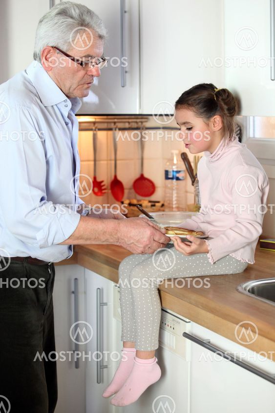 Granddad and granddaughter in the kitchen