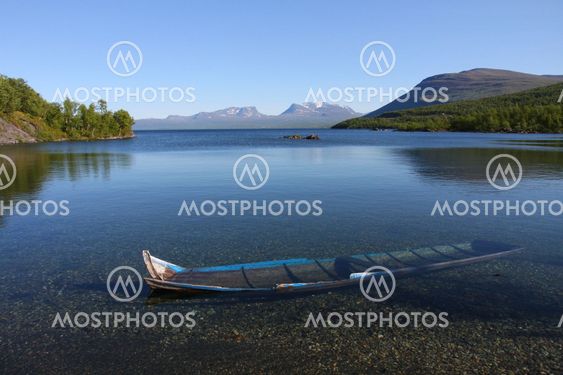 Laporten in Abisko swedish lapland, with a rowing boat in foreground