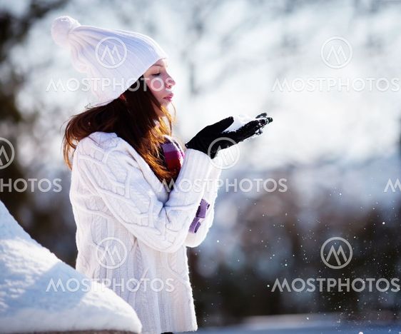 Girl playing with snow