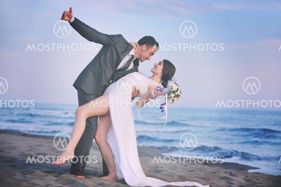 romantic beach wedding at sunset