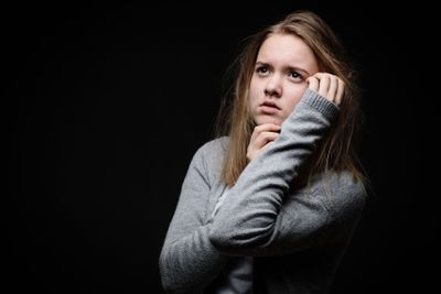 Distressed female teen - victim of domestic violence,...