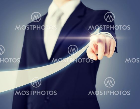 businessman hand showing arrow on virtual screen
