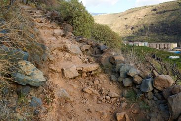 Mountain, trail or rocks with hill or dirt road for...