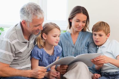 Family reading a book together