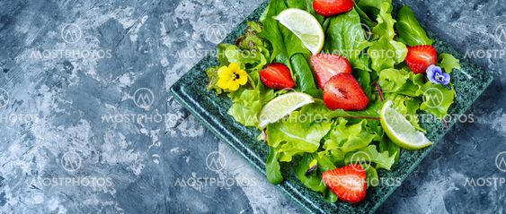Bowl of salad with strawberry
