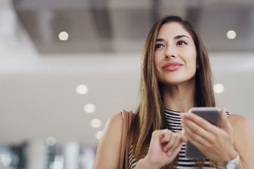 Travel, woman and thinking with smartphone for hotel,...