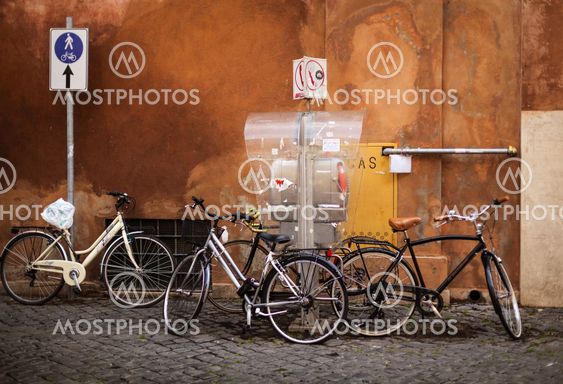 Three bicycles under the wall