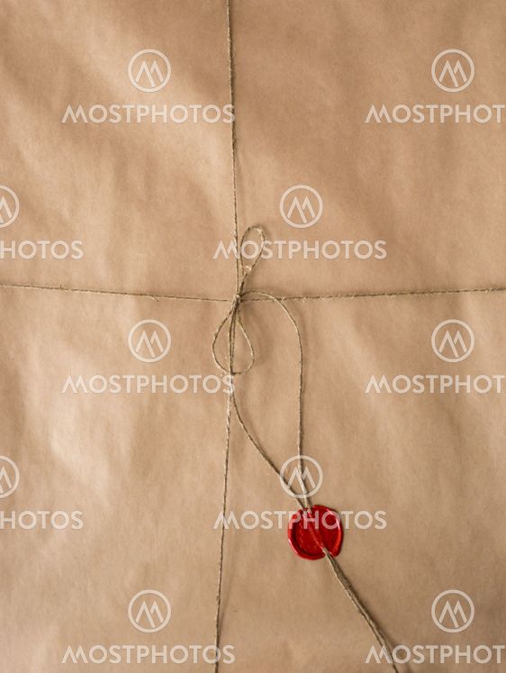 old paper with red wax seal and twine