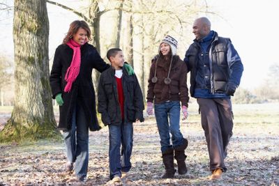 Family On Autumn Walk In Countryside