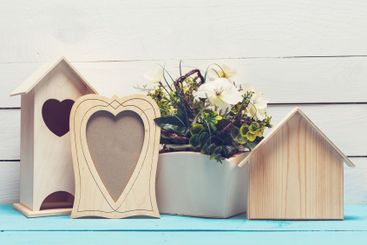 Shabby chic style home decorations on wooden background