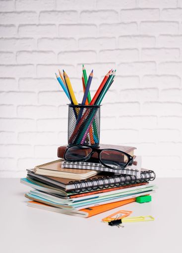 Colorful stationery arrangement on a table with...