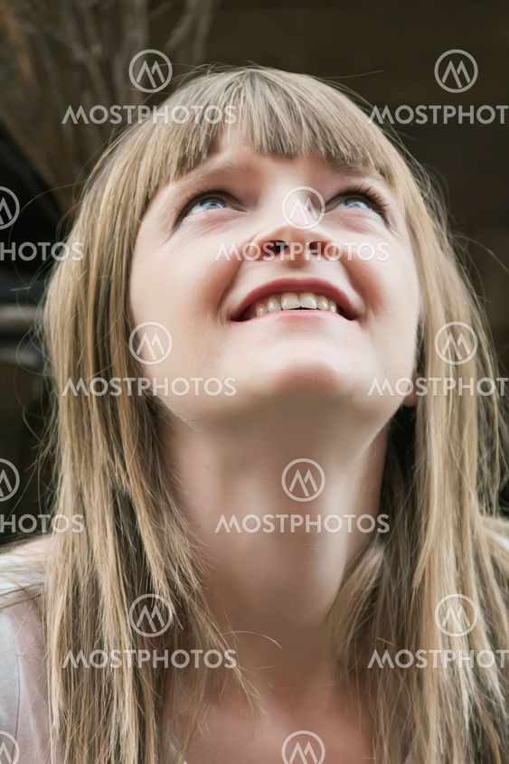 Blond woman looking upwards